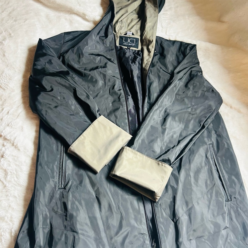 Tan and Black Hooded Raincoat with Water-Resistant Fabric